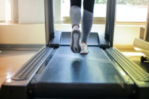 Women legs running on treadmill